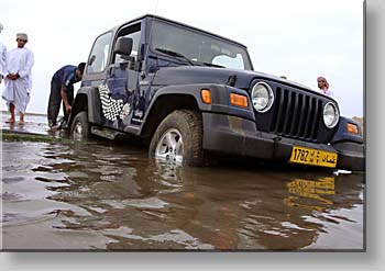 the consequences of insane driving - a sinking 4WD caught by undersea cables at Al-Sawadi beach